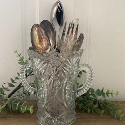 glass vase with silverware
