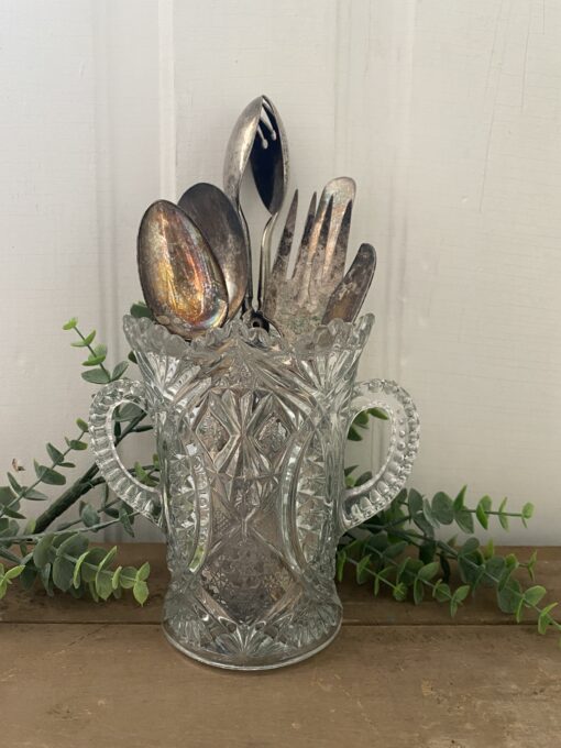 glass vase with silverware